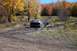 1979 Ford Bronco - A truck navigates a muddy off-road trail during autumn.