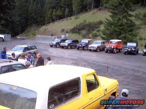 Yellow SUV with white top, 3q front view. Matches 1976 Ford F-100 claim