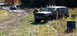 1979 Ford Bronco - A Jeep Cherokee XJ navigates a muddy off-road course with another vehicle in the background.