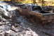 1979 Ford Bronco - This Dodge pickup is deep in the mud, with water and muck splashing around its tires.