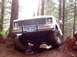 1976 Ford F-100 - This pickup truck, likely from the early to mid-1970s, navigates a challenging off-road course.