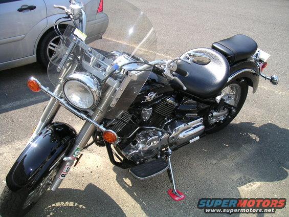 Black motorcycle with chrome accents and a windshield