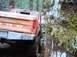 1976 Ford F-100 - This 1976 Ford F-100 is navigating a tight spot between trees.