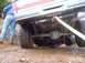 1976 Ford F-100 - Underneath view of a 1976 Ford F-100 showing its rear axle and suspension system.