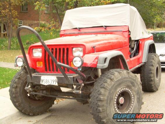 coney-flats-10806-002.jpg sick YJ behind me...dana 60 front, full cage, all kinds of crazy sh*t