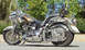 1999 Harley-Davidson Fat Boy - This 1999 Harley-Davidson Fat Boy features custom paint and chrome, viewed from the side.