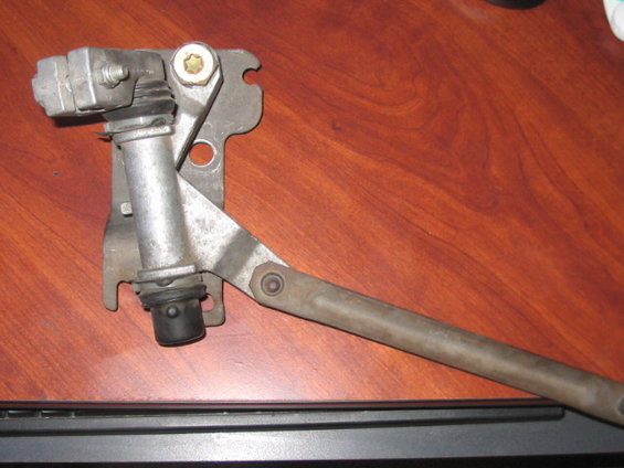 windshield wiper linkage assembly with metal arm and bracket