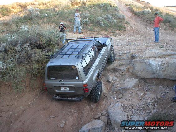 1996 Toyota 4Runner navigating a rocky trail, rear view