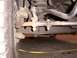 1988 Ford C-350 (Centurion Conversions) - Front suspension steering linkage components are visible in this close-up shot.