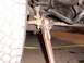 1988 Ford C-350 (Centurion Conversions) - A large wrench is used to adjust the tie rod end on a vehicle's steering linkage.