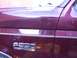 1988 Ford C-350 (Centurion Conversions) - The F-350 Lariat badge is clearly visible on the side of the burgundy truck.