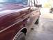1988 Ford C-350 (Centurion Conversions) - Side profile of a maroon 1988 Ford C-350 (Centurion Conversions) truck, showing its chrome trim and F250 badging.
