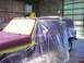 1988 Ford C-350 (Centurion Conversions) - Vehicle being prepped for paint, covered in plastic and tape. Text on window visible.