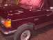 1988 Ford C-350 (Centurion Conversions) - Close-up of the front fender and hood of a 1988 Ford C-350 (Centurion Conversions) truck.
