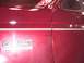 1988 Ford C-350 (Centurion Conversions) - Close-up of a red truck's side panel showing the F-350 emblem.