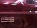 1988 Ford C-350 (Centurion Conversions) - Close-up of the F-350 Lariat badging on the side of a maroon truck.