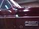 1988 Ford C-350 (Centurion Conversions) - Close-up of a maroon truck door showing the F-350 XLT LARIAT badging.