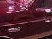 1988 Ford C-350 (Centurion Conversions) - Close-up of a maroon 1988 Ford C-350 Lariat showing the side profile and badging.