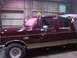 1988 Ford C-350 (Centurion Conversions) - Maroon 1988 Ford C-350 (Centurion Conversions) pickup truck with tan lower body trim, seen from the side.