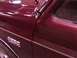 1988 Ford C-350 (Centurion Conversions) - Close-up of a maroon Ford F-350 truck, highlighting the body lines and trim.