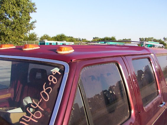 Red van roof with amber lights and handwritten date 1989