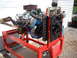 1969 Ford Mustang - Ford V8 engine on a stand, likely from a 1969 model, with custom headers and cooling system.