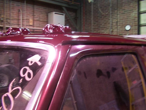 Maroon roof with custom bubble-like additions and '88' written on window