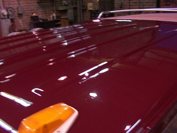 Red roof with a chrome rack and an orange marker light