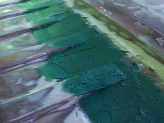 Body filler applied to ribbed metal panels