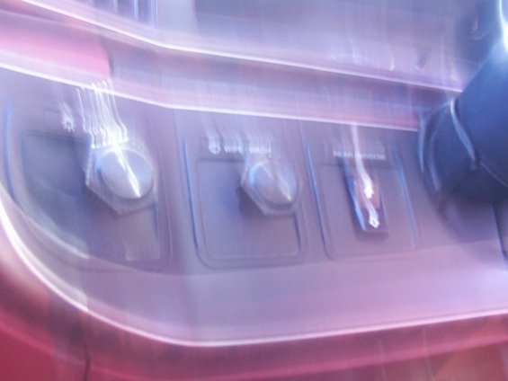 Dashboard controls with knobs and a switch labeled 'WIPE WASH'
