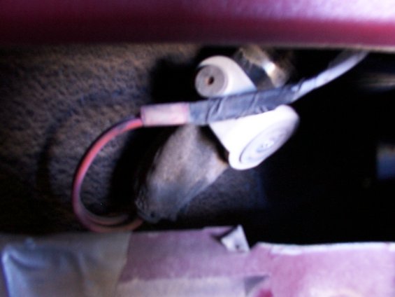 Close-up of wiring connected to a white plastic door lock actuator