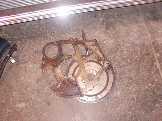 Transmission bell housing and flywheel assembly on concrete floor