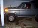 1985 Ford Bronco - This 1985 Ford Bronco is shown from the side, its off-road tires and a utilitarian gray exterior.