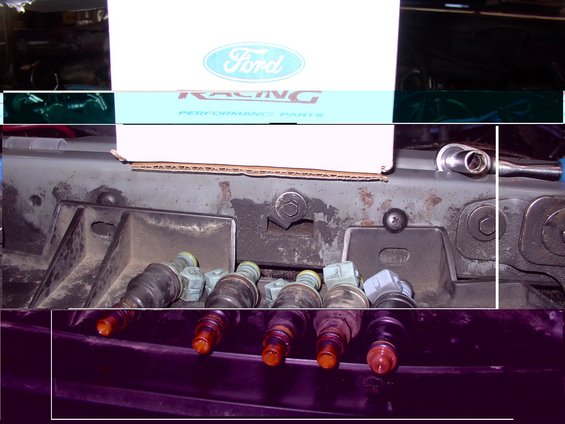 Ford Racing box above fuel injectors