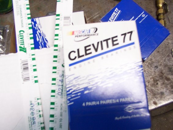 Clevite 77 engine bearings box with NASCAR Performance logo, next to feeler gauges