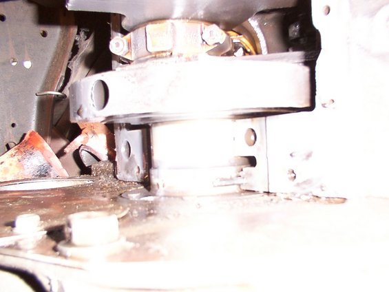 Close-up of engine component with metal shavings and debris