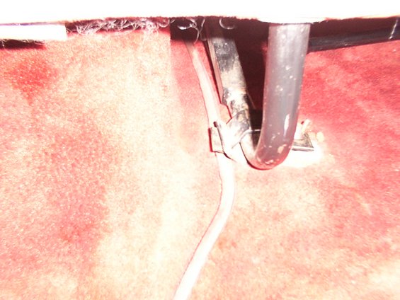 Rear seat mount hardware with red carpet