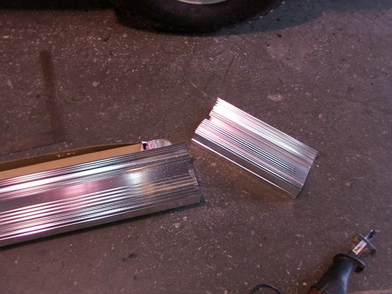 Cut aluminum running boards on concrete floor with reciprocating saw