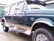 1988 Ford C-350 (Centurion Conversions) - This Ford F-Series SUV conversion features a two-tone paint scheme and prominent running boards.