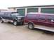 1988 Ford C-350 (Centurion Conversions) - Two Ford Bronco Centurions are parked outside storage units.