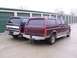 1988 Ford C-350 (Centurion Conversions) - Two Ford Bronco Centurion conversions are parked side-by-side in front of a row of storage units.