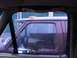 1988 Ford C-350 (Centurion Conversions) - Side view of a burgundy truck cab, with a focus on the window and side mirror.