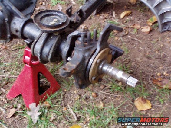 Front axle assembly on red jack stand