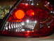 2005 Dodge SRT-4 - Tail light assembly with visible date stamp OCT 12 2006 and Supermotors.net logo.