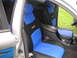 1999 Ford Taurus - Interior view of a car with custom blue and black seat covers installed.