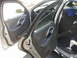 1999 Ford Taurus - View of the interior door panel and seats of a 1999 Ford Taurus, showing the driver's side door open.