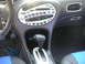1999 Ford Taurus - Interior view of a 1999 Ford Taurus, highlighting the center console and dashboard details.