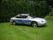 1999 Ford Taurus - This sedan has custom flame decals on its side and chrome wheels.