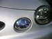 1999 Ford Taurus - Close-up of a silver car's front corner, showing the headlights and a fog light. The vehicle's year is not identifiable from this view.