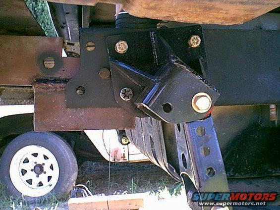 rearmount.jpg this was a pain to setup i used 1 shackle hanger bolt 3 other bolts on this side and almost the same on the other. i then tac weleed it to the rear frame rails just to be sure.